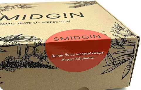 A Smidgin gift box with a personalised message printed on a coral label